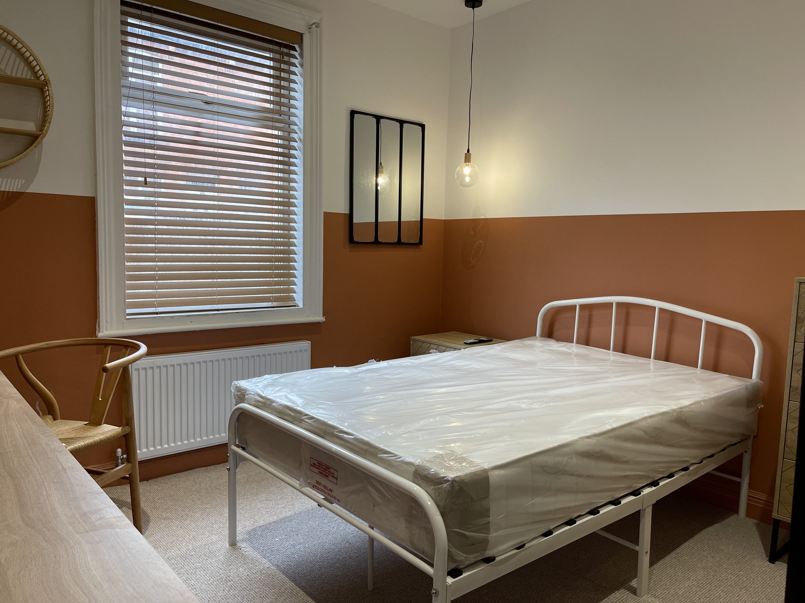 Simple student bedroom with study space