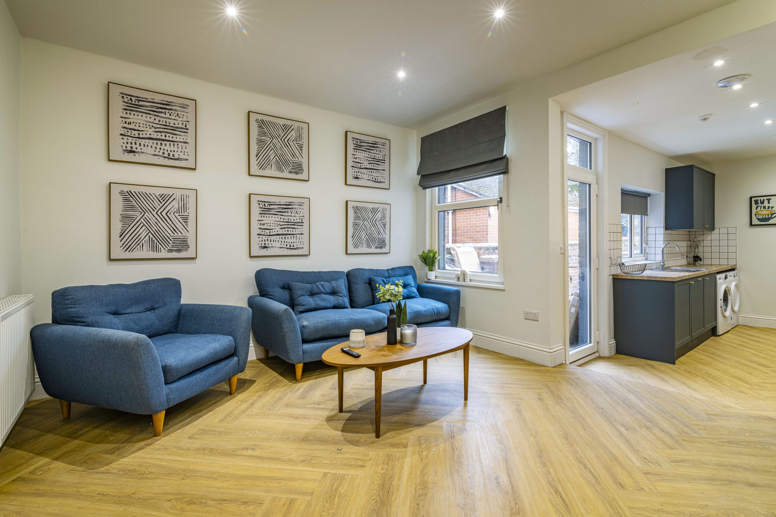 Large student living area with blue furniture