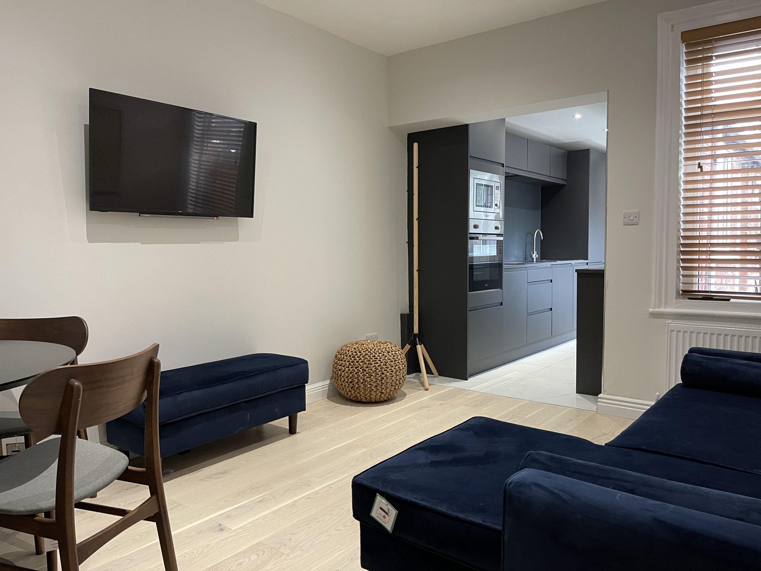 Modern student living space with kitchen view